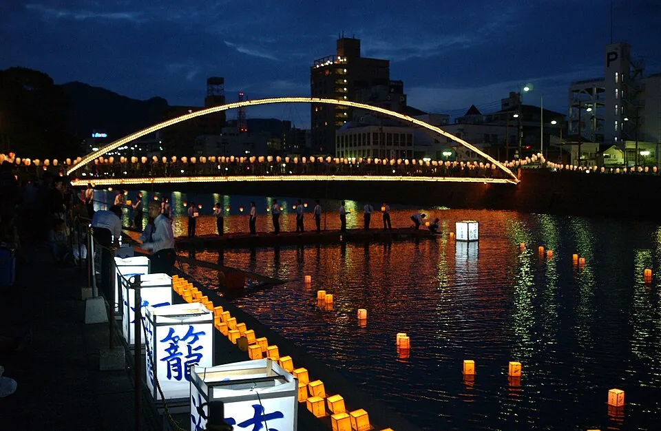 Candlelit lanterns placed in the Sasebo River during Obon, Japan (U.S. Navy photograph).