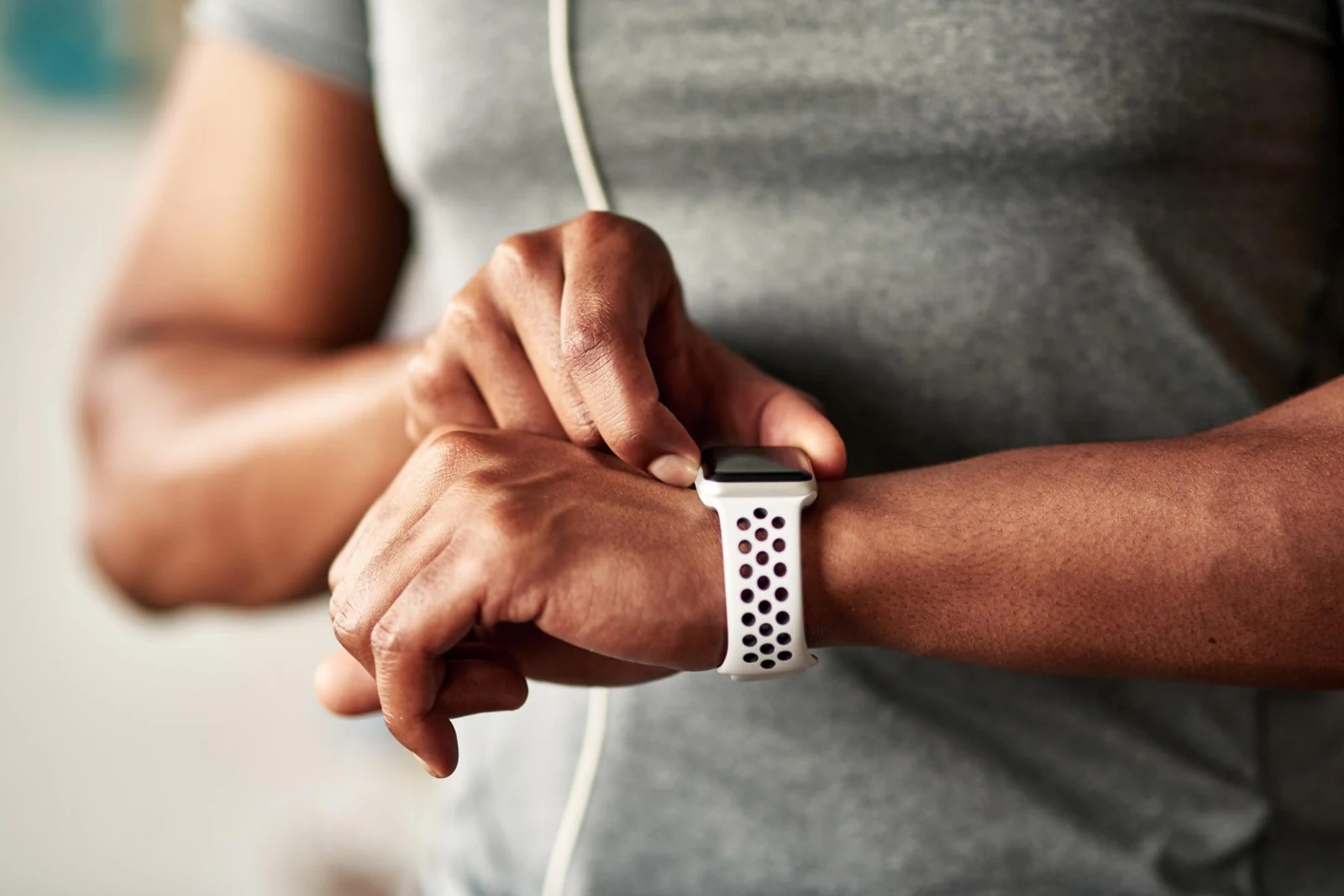 Person interacting with a wrist-worn smartwatch